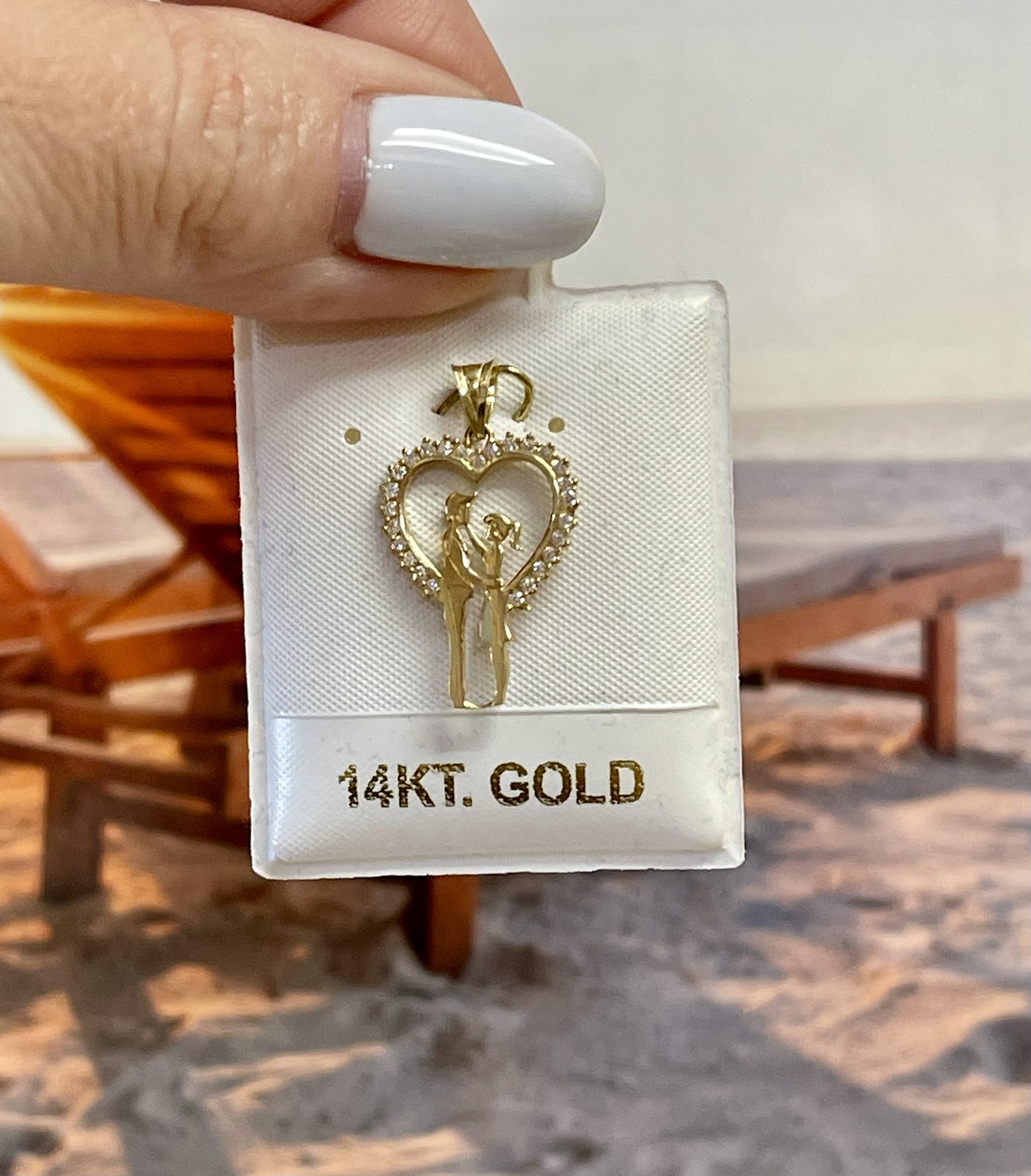 18k gold necklace displayed on a dark bust