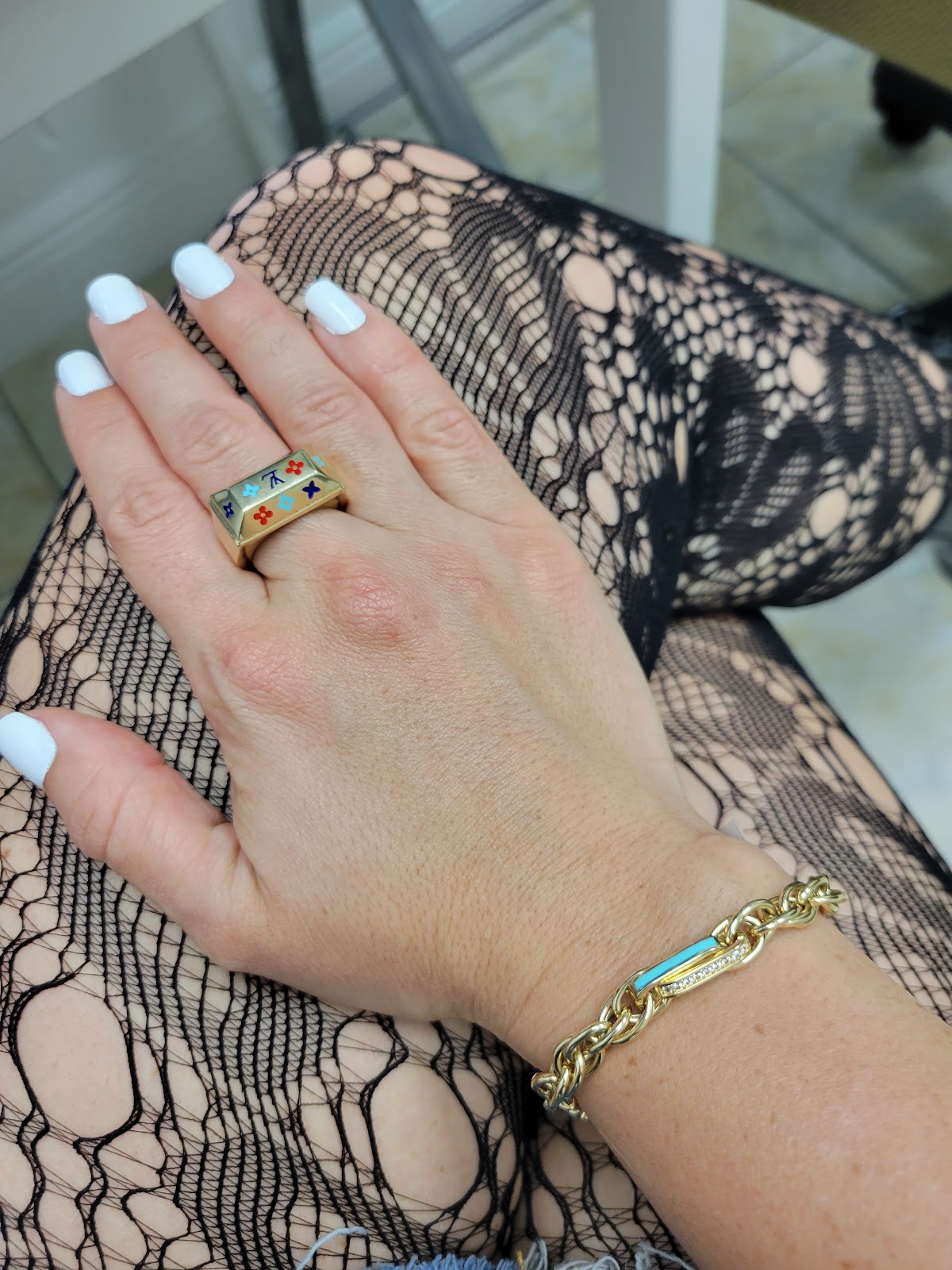 A pair of gold and diamond stud earrings