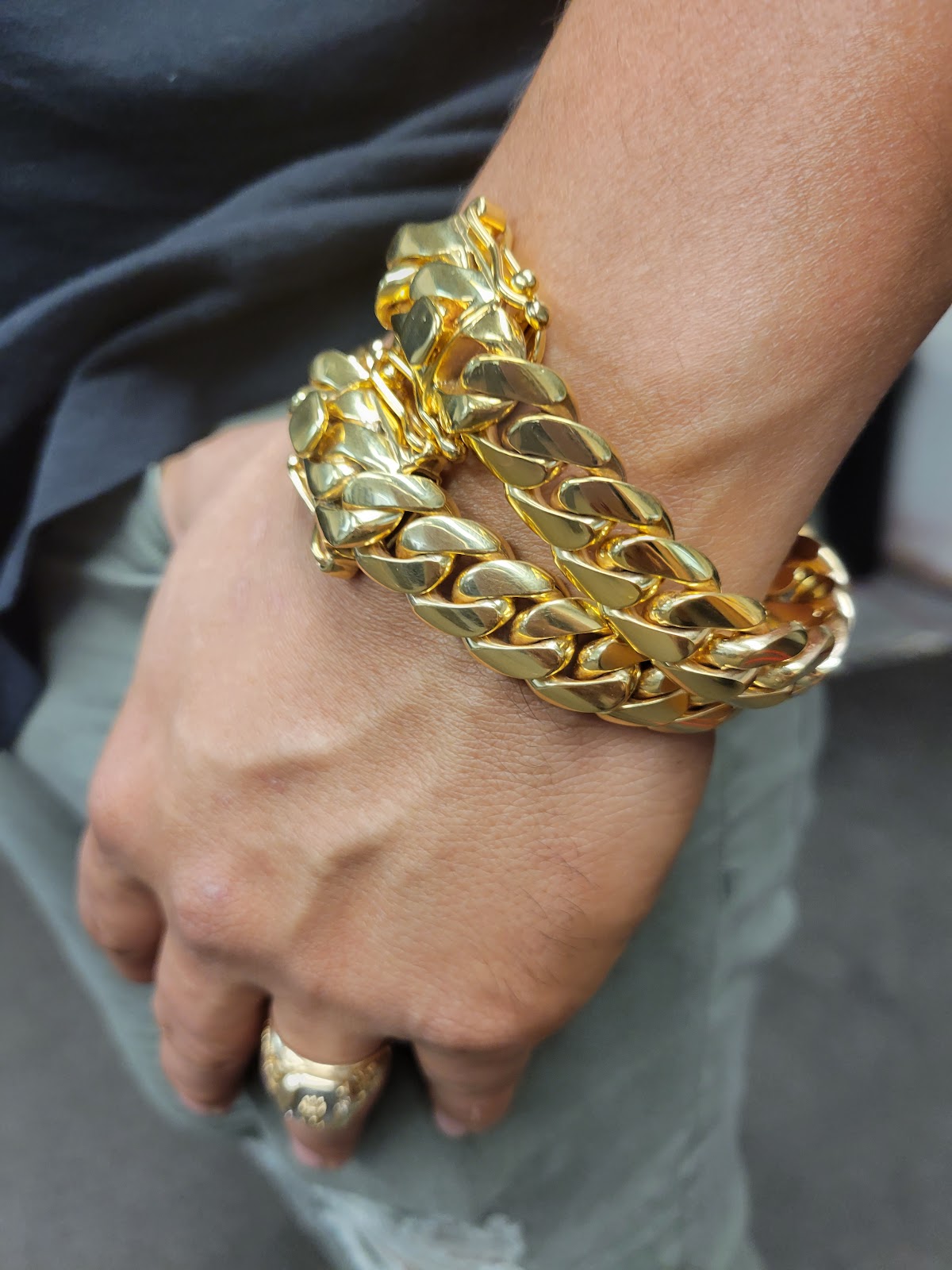 A master jeweller setting a stone by hand at the atelier bench