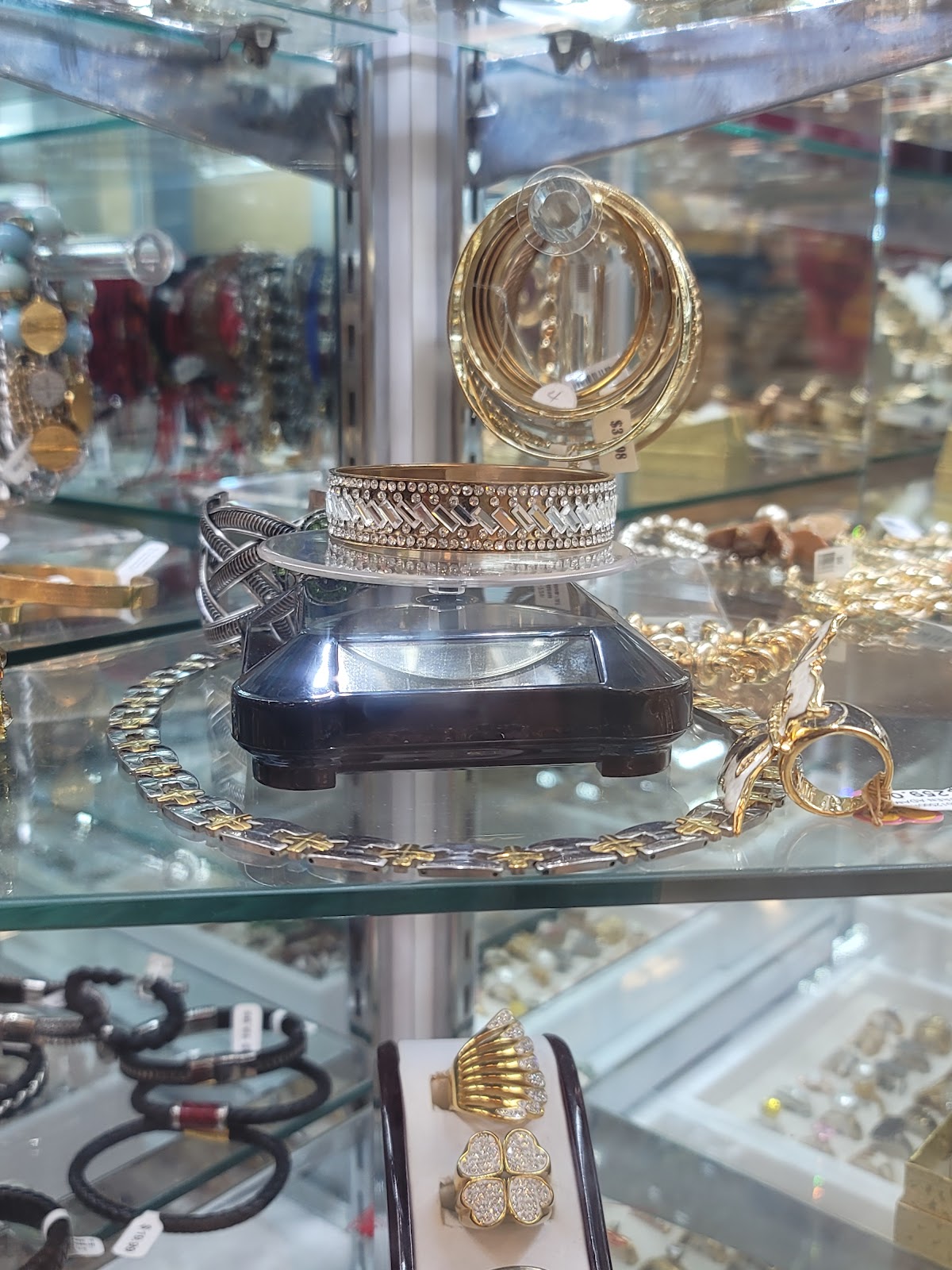 A pair of gold and diamond stud earrings