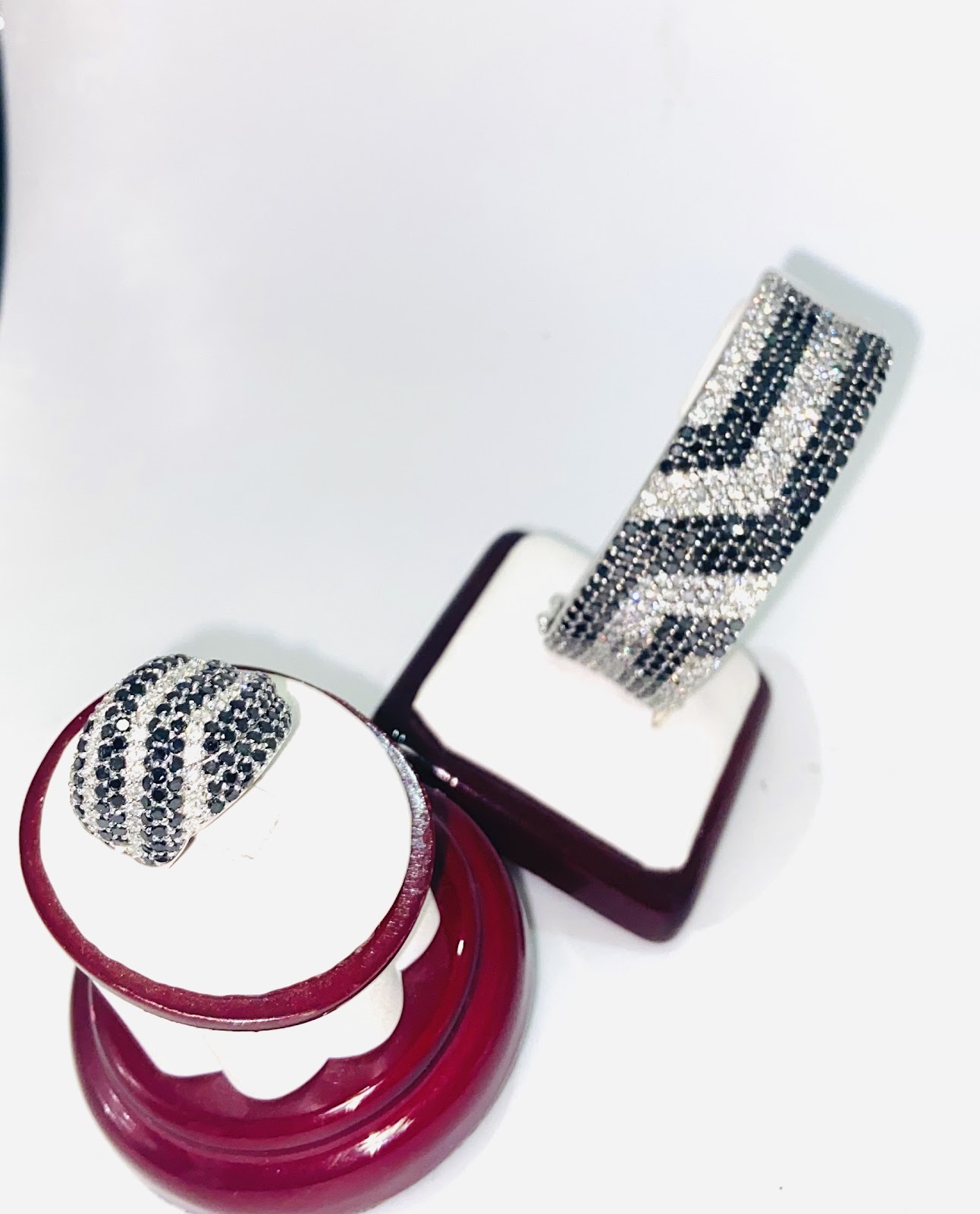 A diamond ring resting on deep red silk