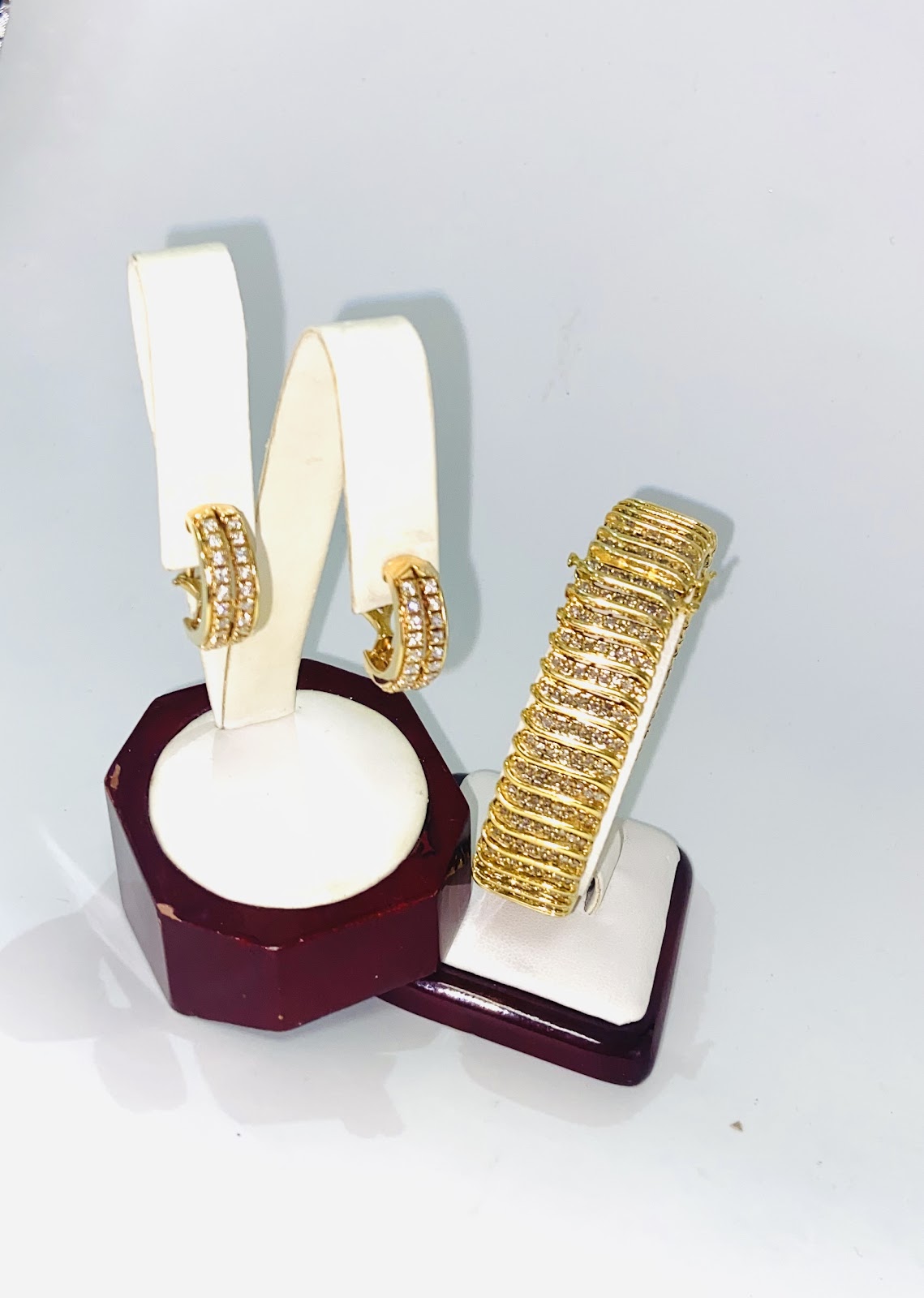 A pair of gold and diamond stud earrings