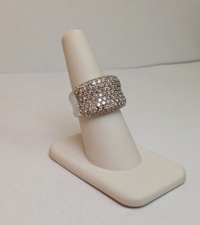 Halo diamond engagement ring on black