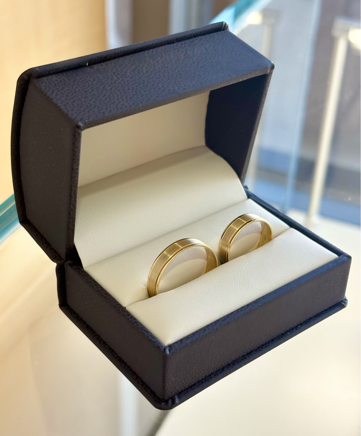 A pair of gold and diamond stud earrings