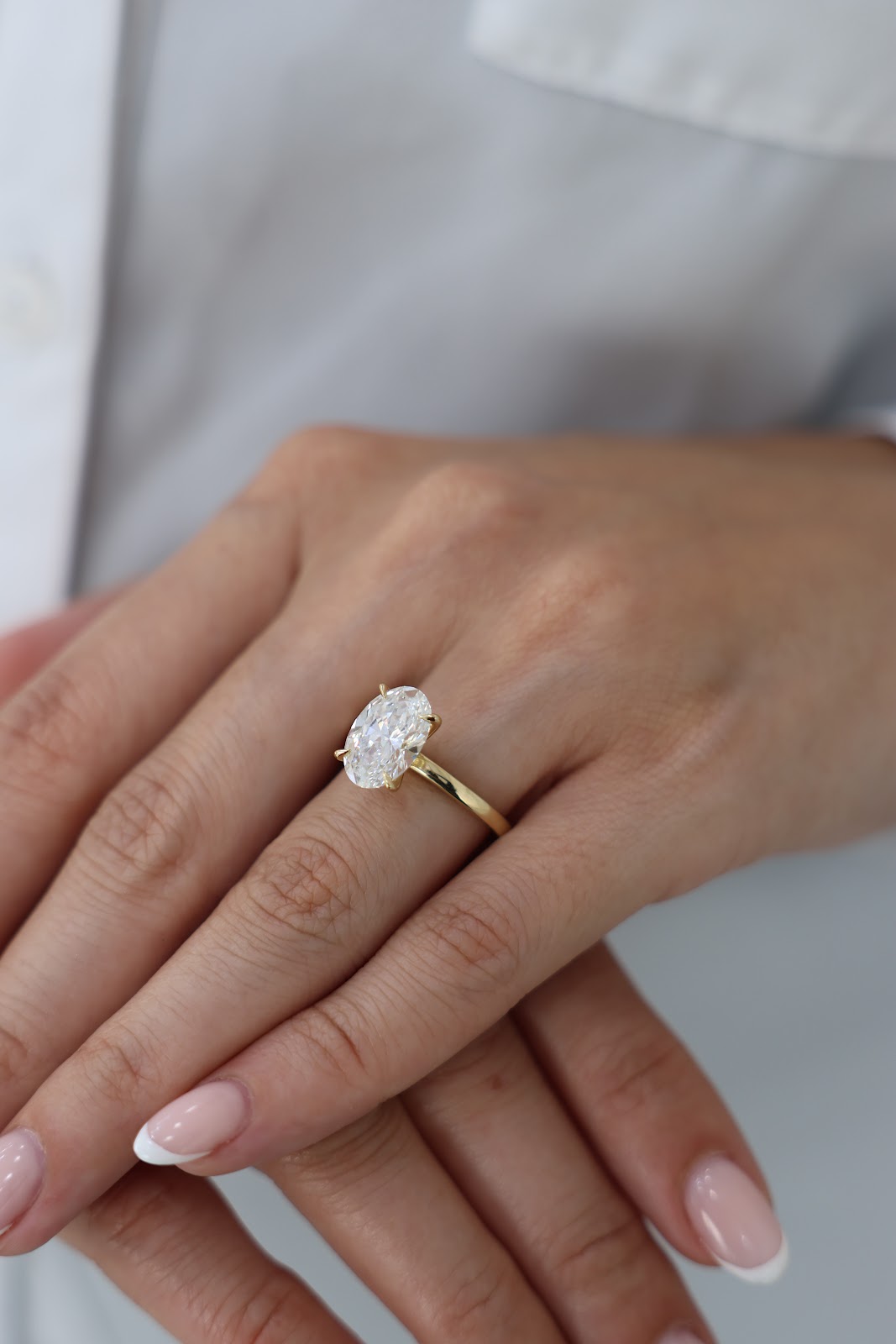 Pink sapphire ring set in rose gold with a diamond halo