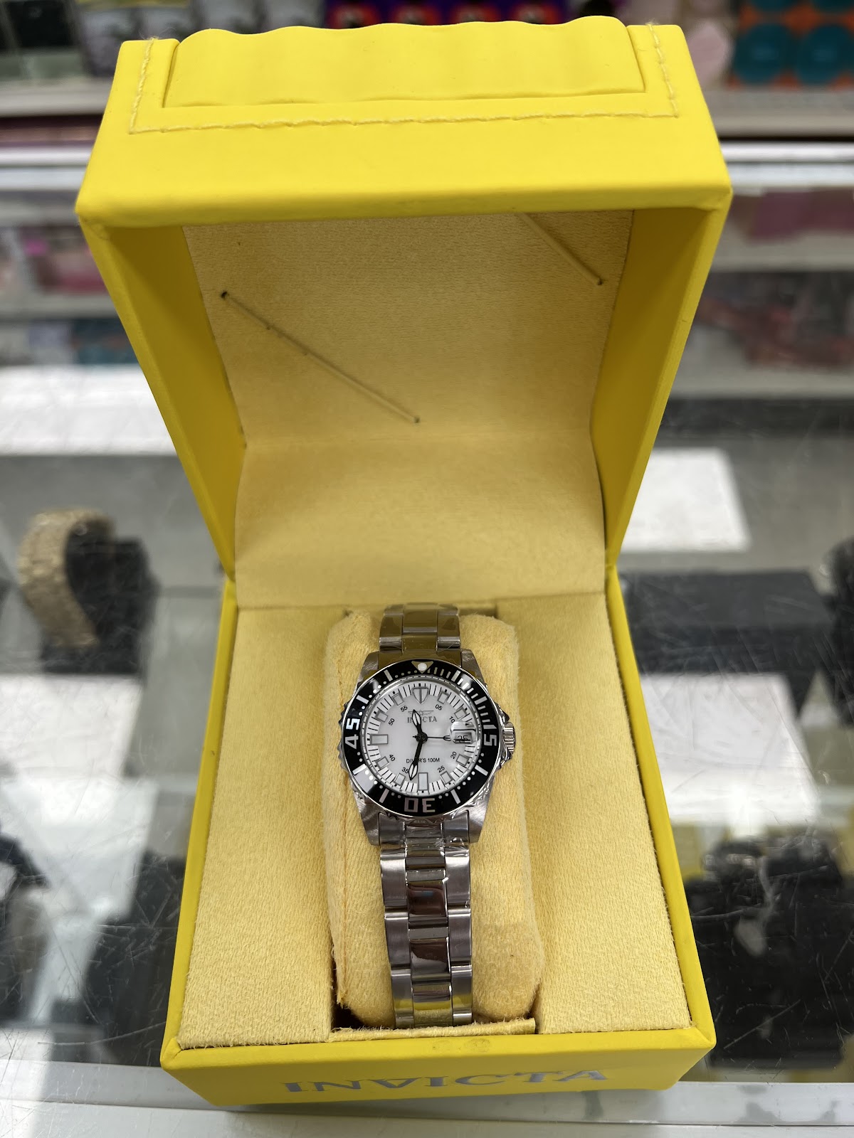 Brilliant-cut diamond solitaire ring on a dark surface