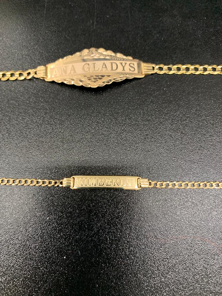Layered fine gold necklaces at the collarbone