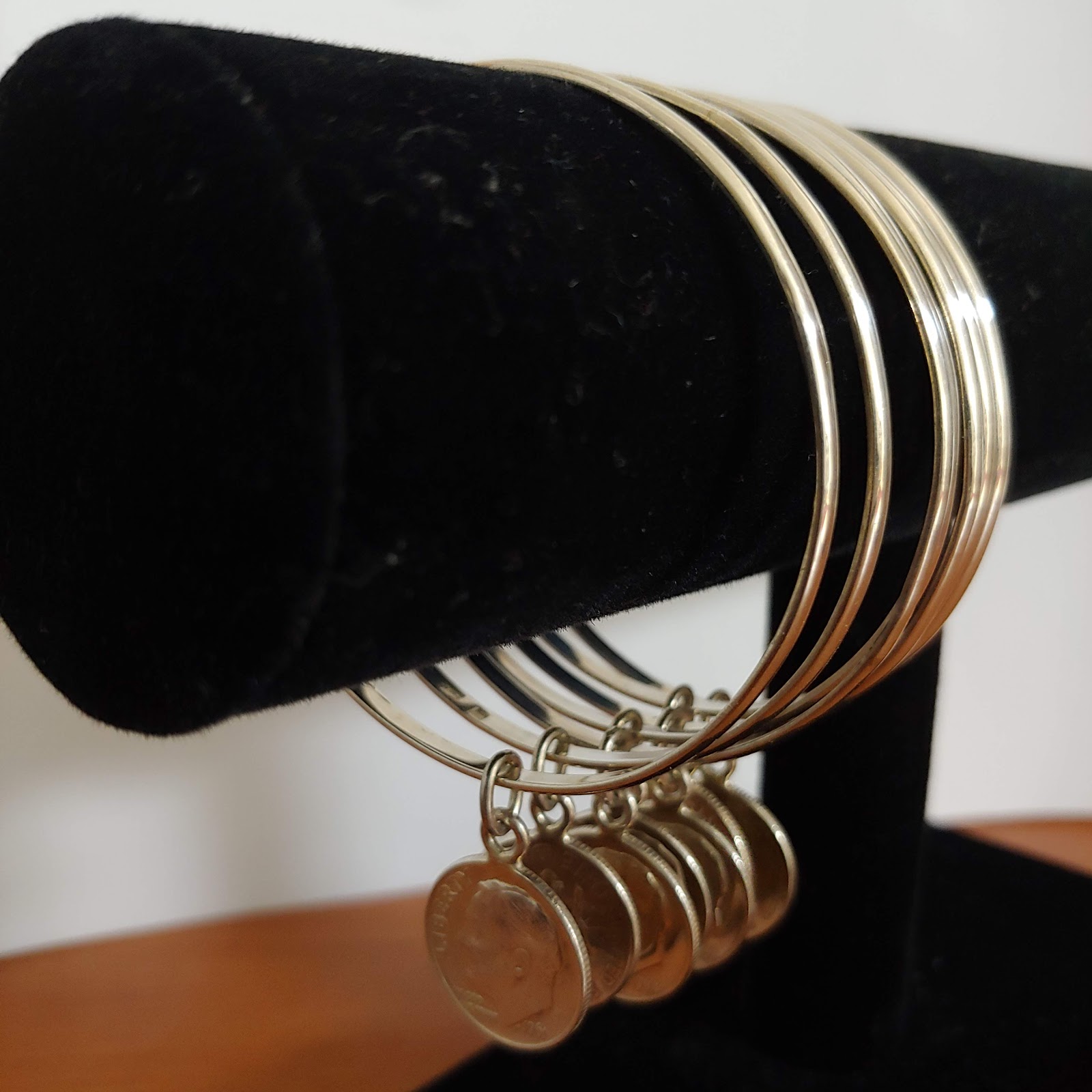 Layered fine gold necklaces at the collarbone