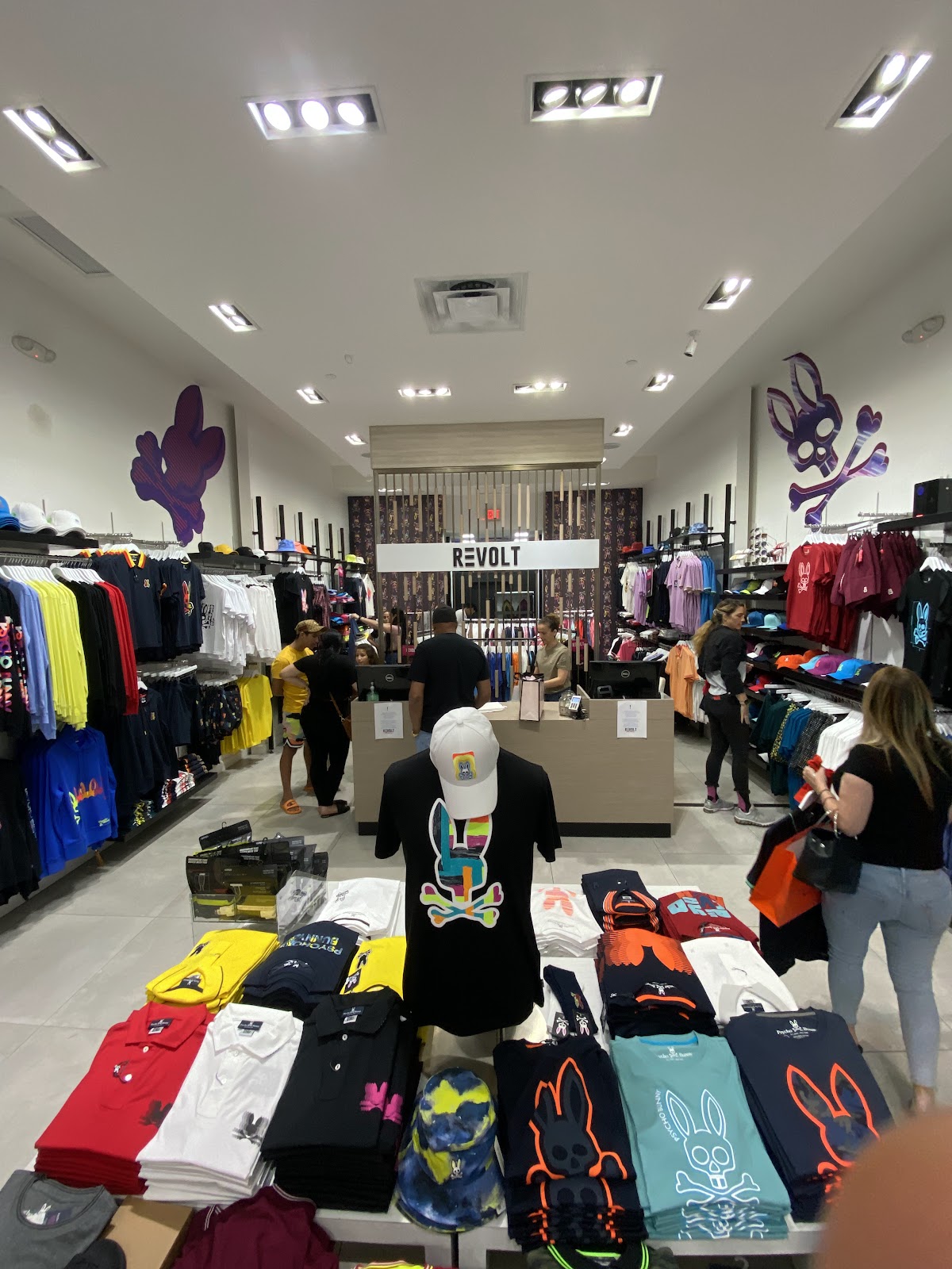 Moody boutique interior with racks of dark garments