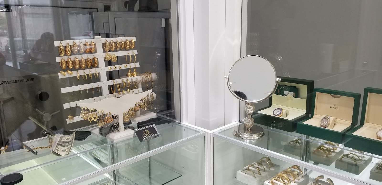 A master jeweller setting a stone by hand at the atelier bench