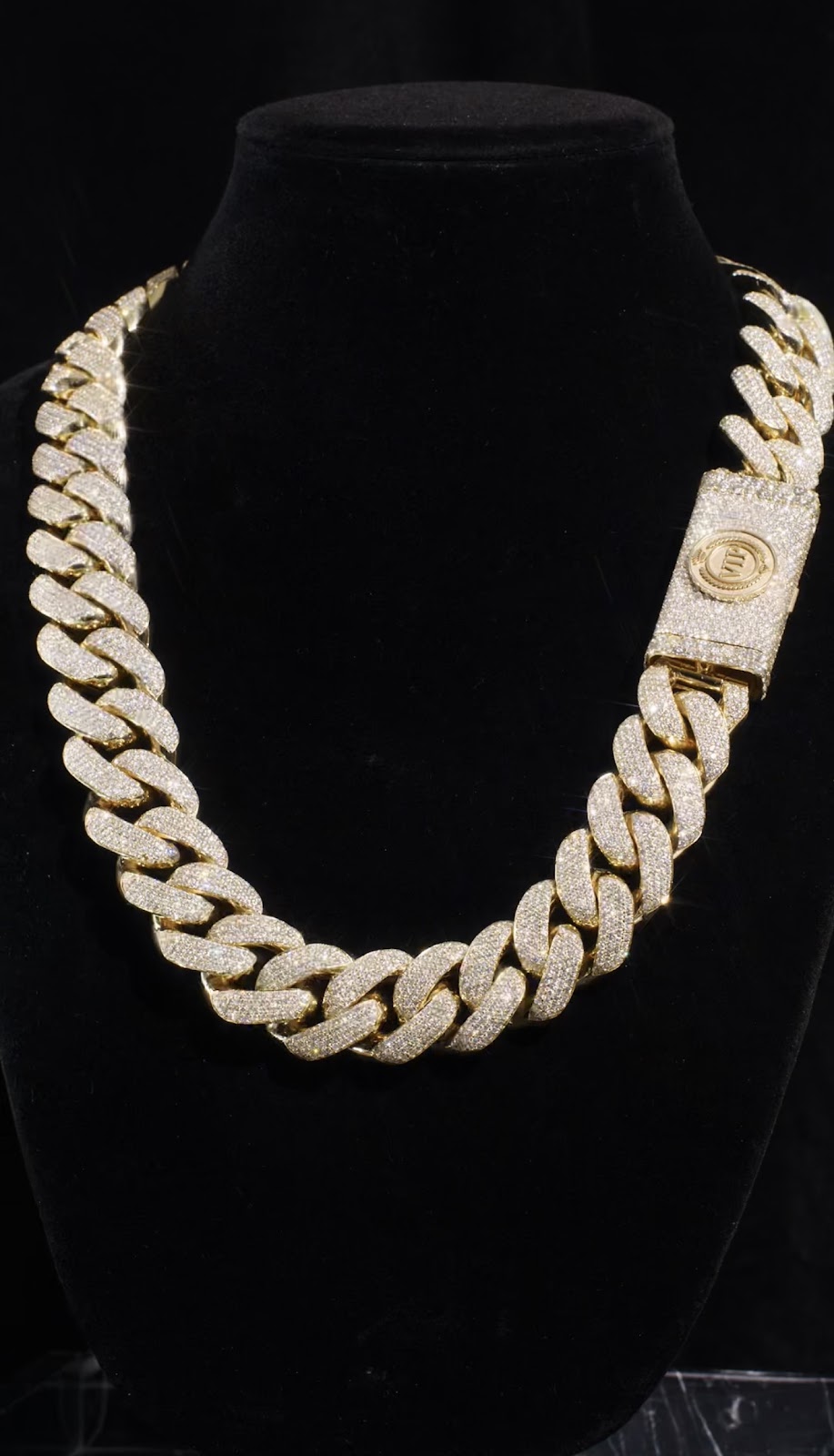 Layered fine gold necklaces at the collarbone